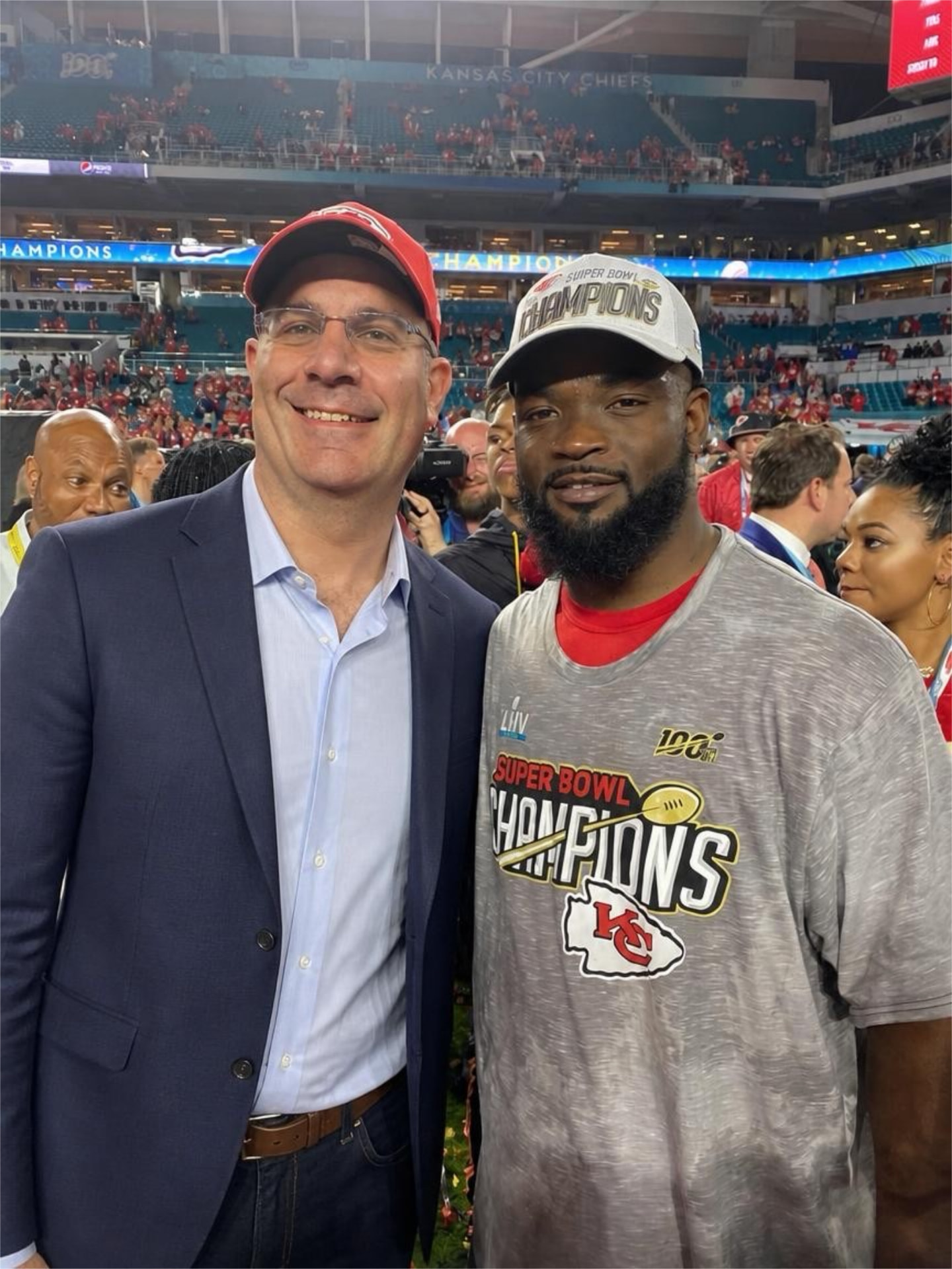 Ian Greengross with a Kansas City Chiefs Super Bowl champion on the field